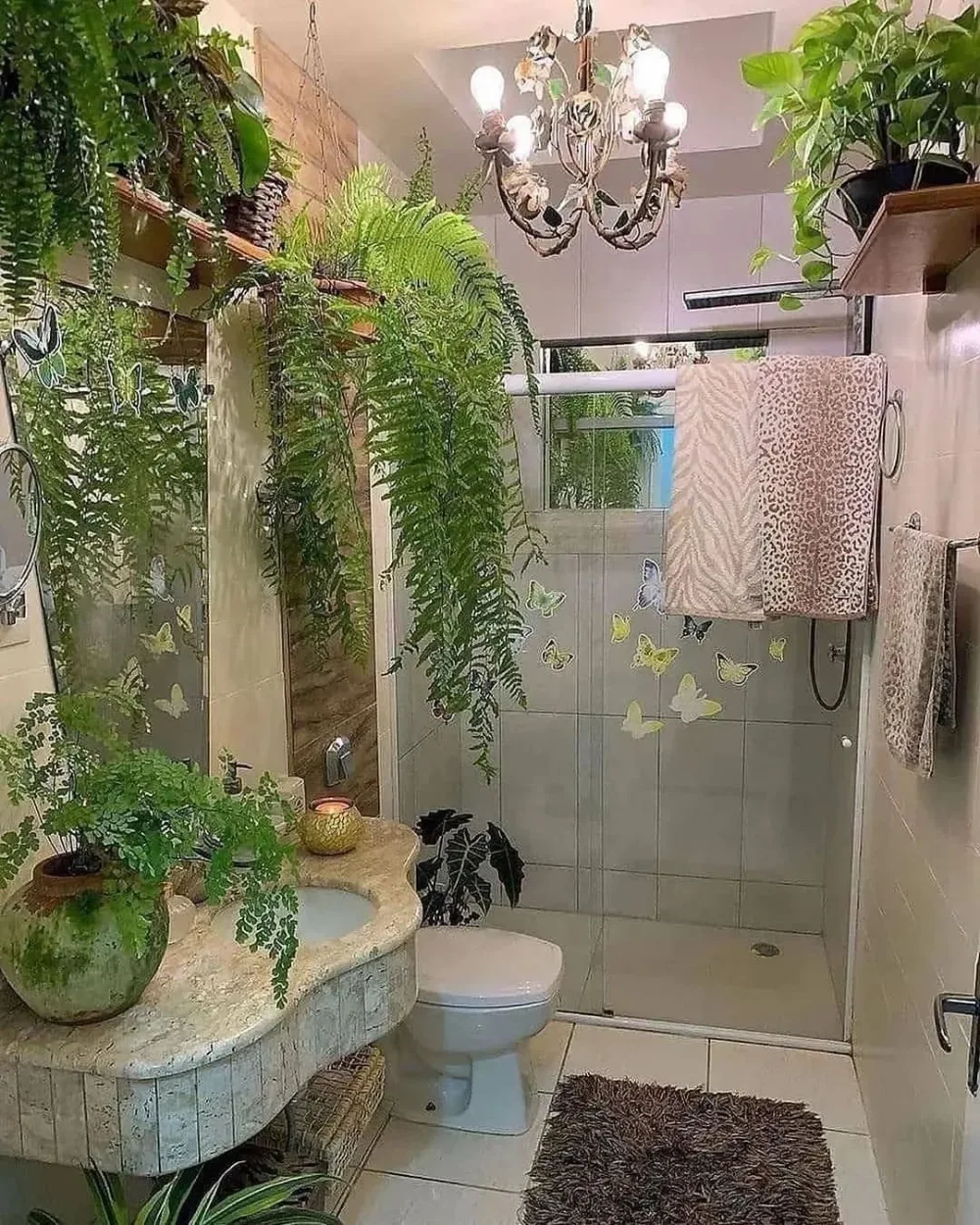Bathroom decorated with hanging ferns and leafy plants