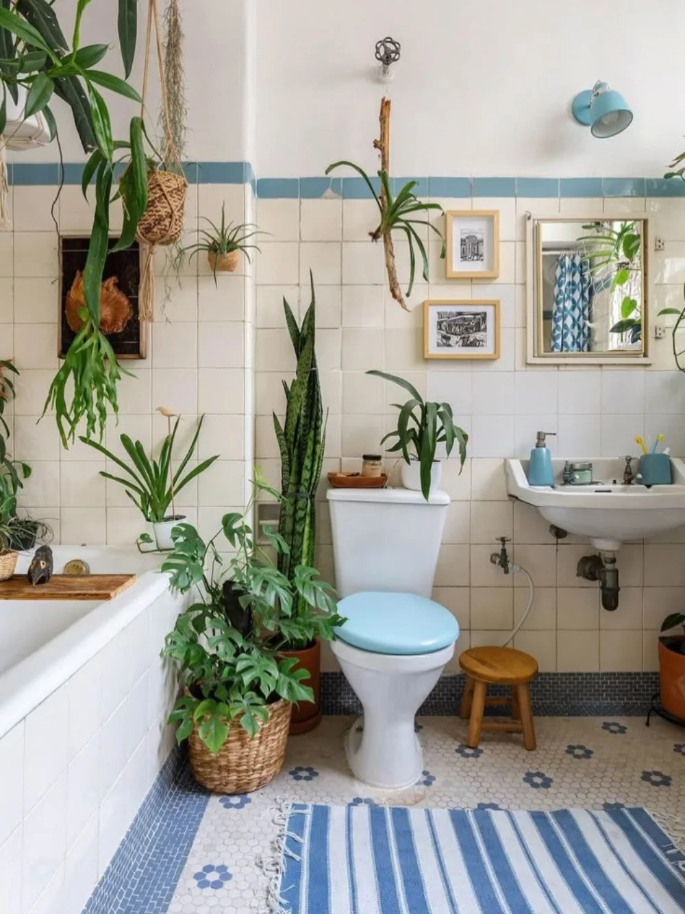 Vintage bathroom decorated with potted tropical and leafy plants