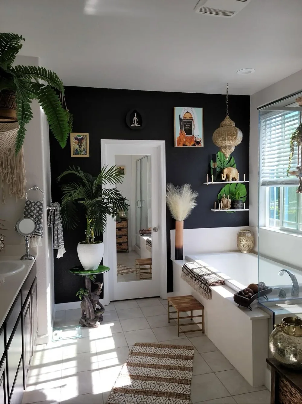 Freestanding bathtub bathroom with palms and hanging fern