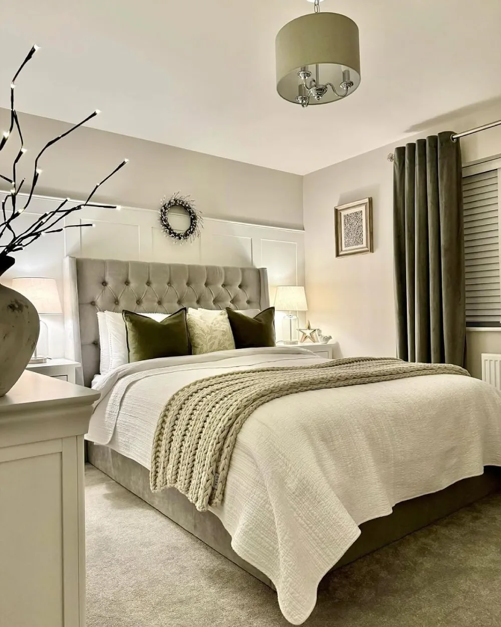 bedroom with woven rattan headboard, botanical pillows, and neutral bedding