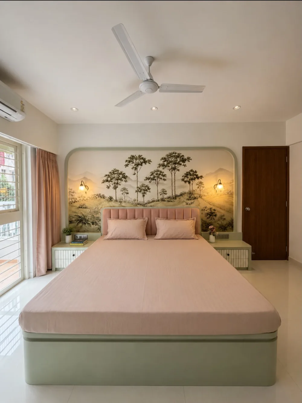 modern sage green bedroom with a curved upholstered headboard, blush bedding, and landscape wall art