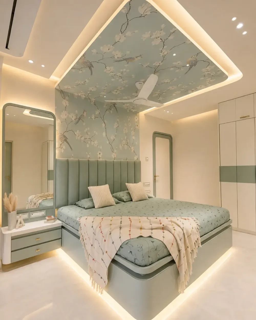 modern green bedroom with floral ceiling, upholstered headboard, and soft lighting
