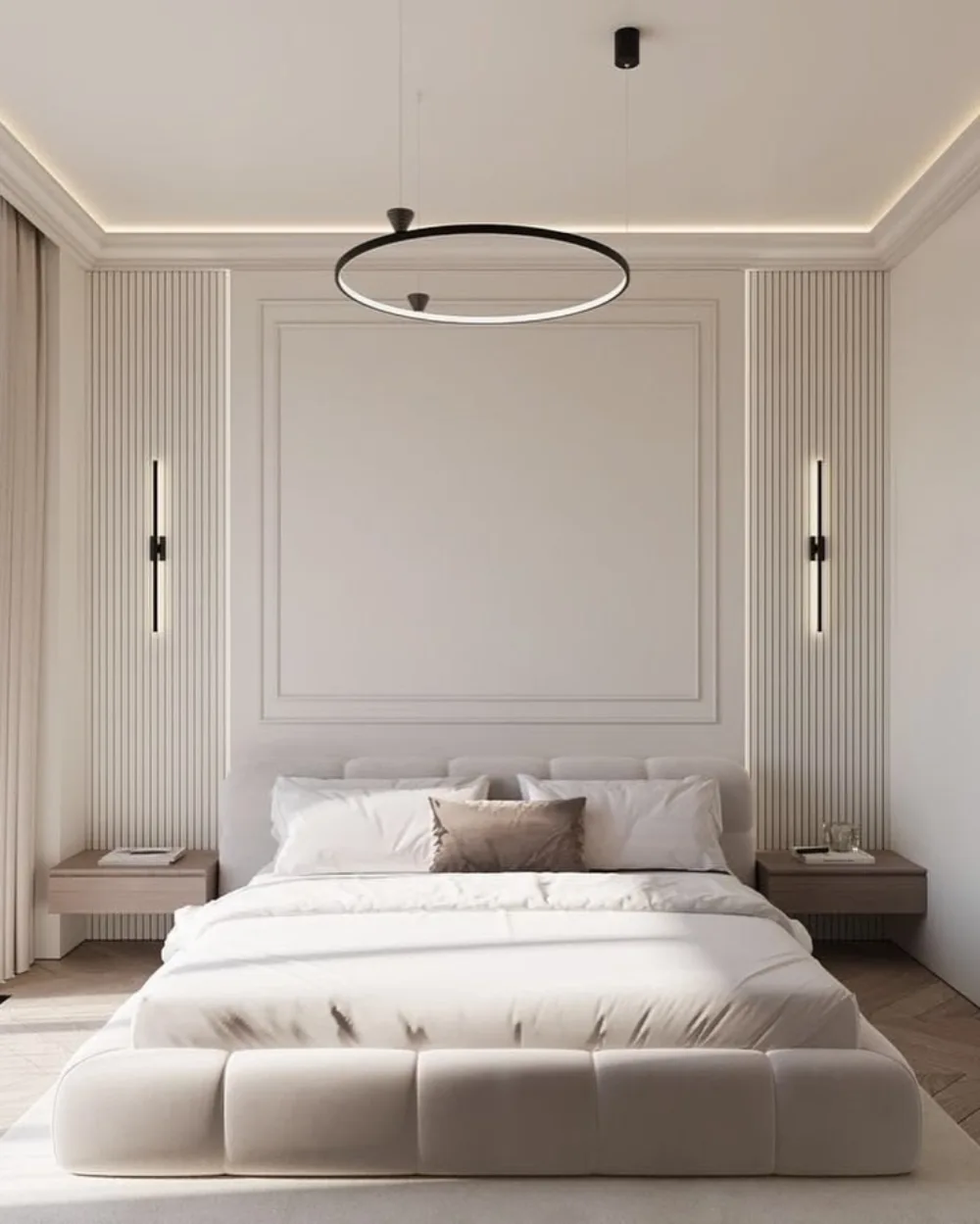 Minimalist neutral bedroom with a white accent wall featuring rectangular molding and vertical slat panels, modern black wall sconces, and a low upholstered bed