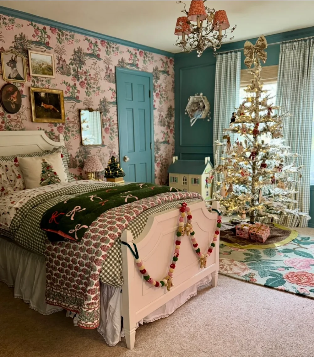 Colorful winter bedroom with floral wallpaper, patterned bedding, and a decorated Christmas tree