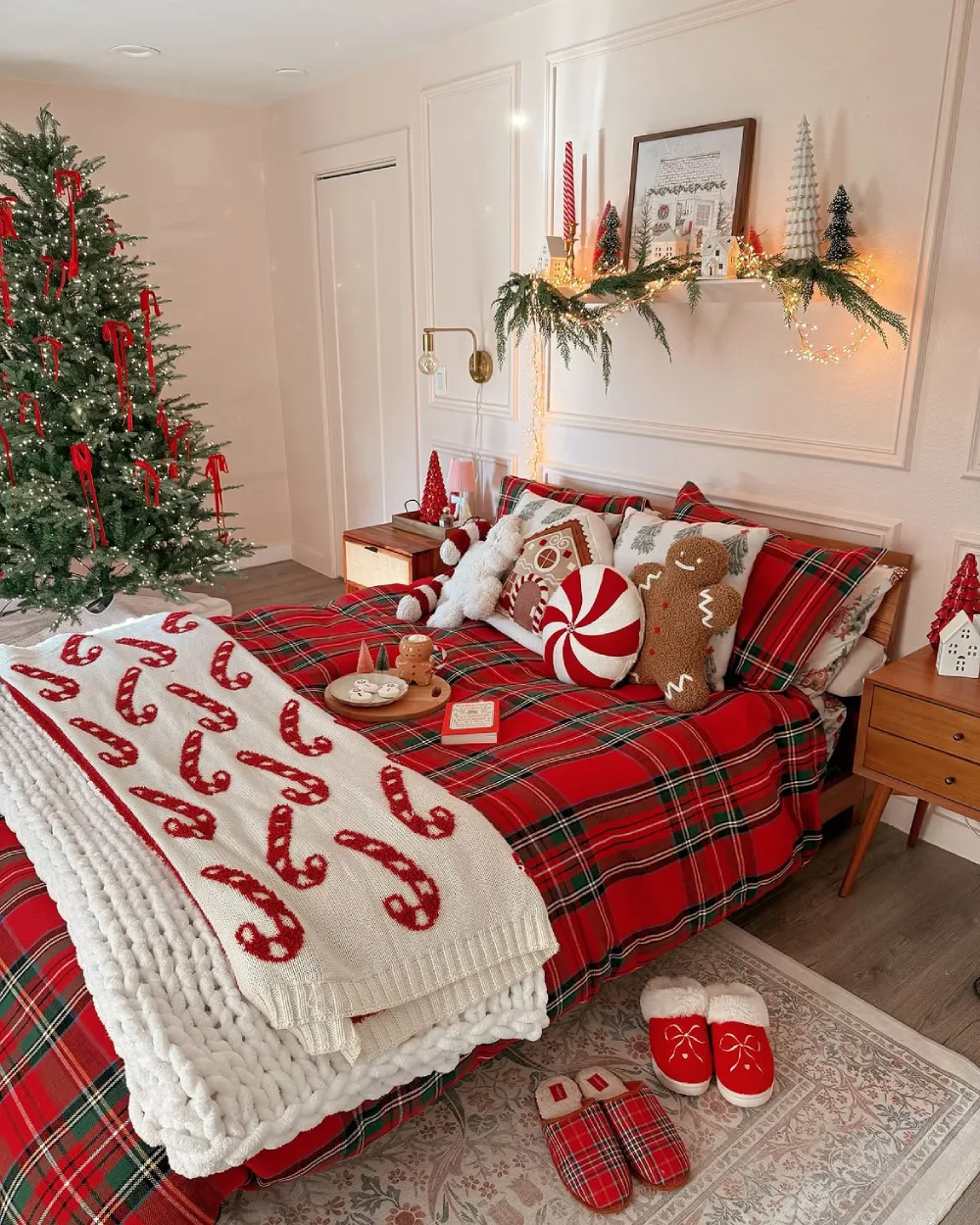 Christmas bedroom with red plaid bedding, candy cane blanket, and festive pillows