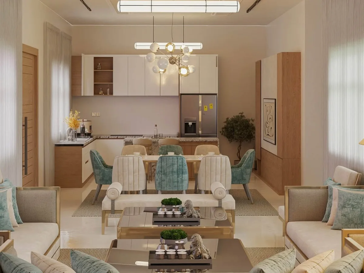 Open-concept dining room connected to a modern kitchen with a warm neutral palette, wood cabinetry, upholstered dining chairs, and contemporary pendant lighting.