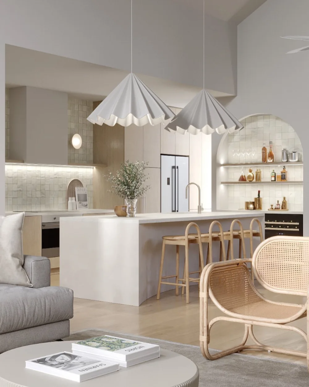 light open-concept kitchen with white island and sculptural pendant lights