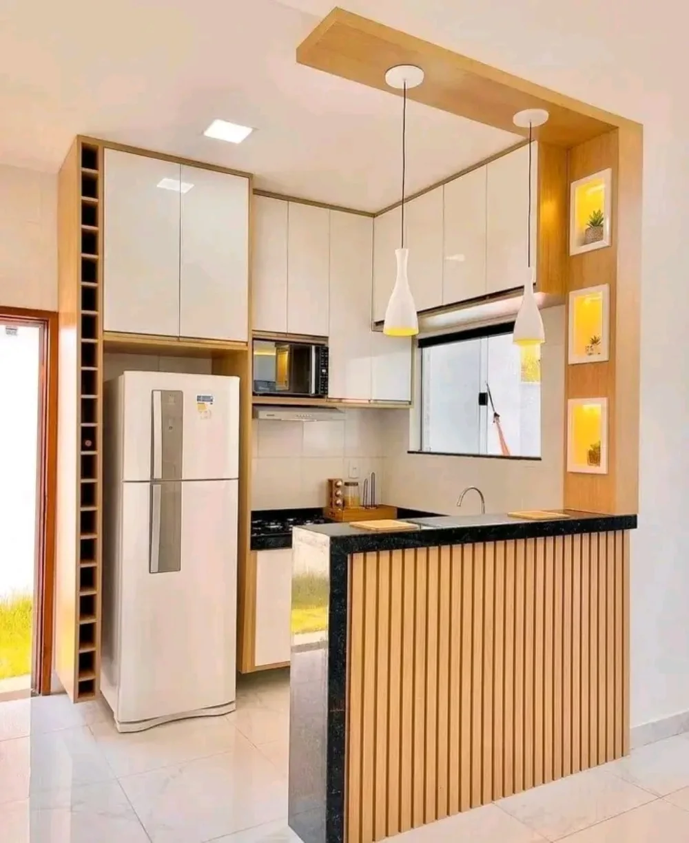 Small modern kitchen with white cabinets and a slim wood peninsula