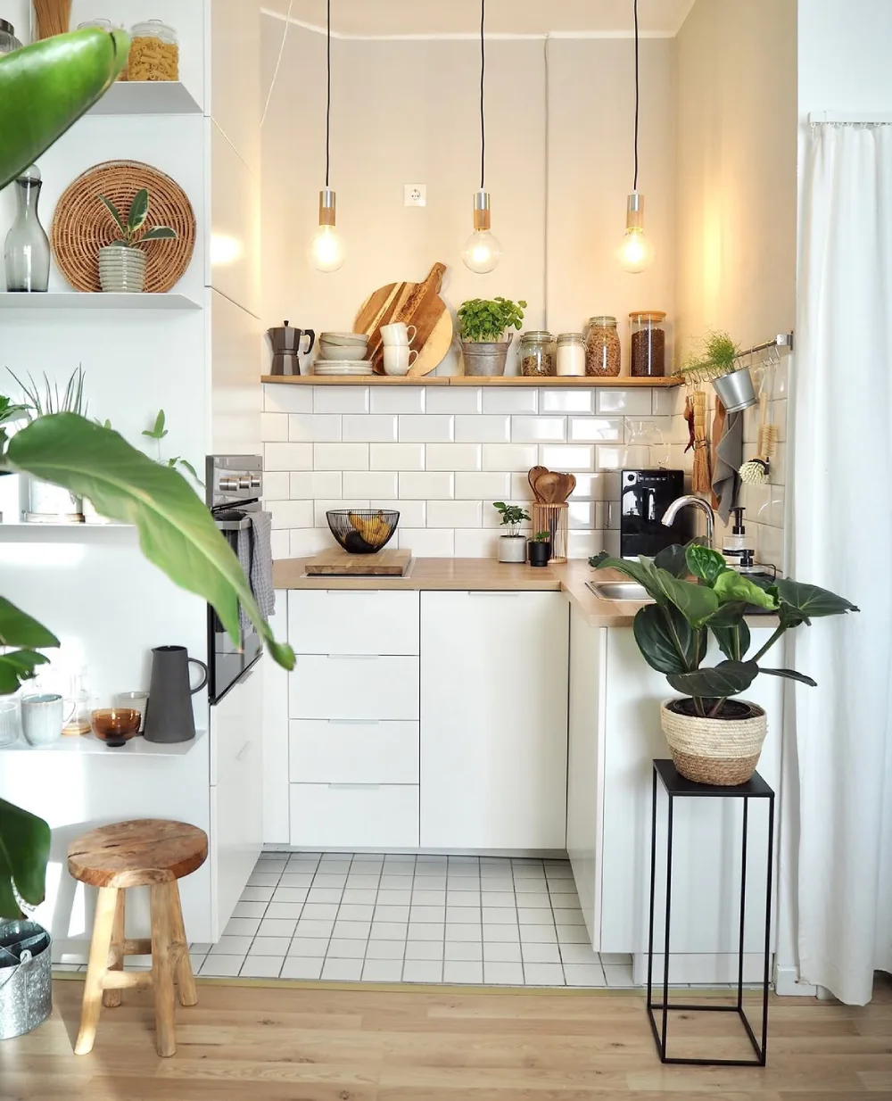 Narrow galley kitchen with wood cabinets, open shelving, and a patterned runner