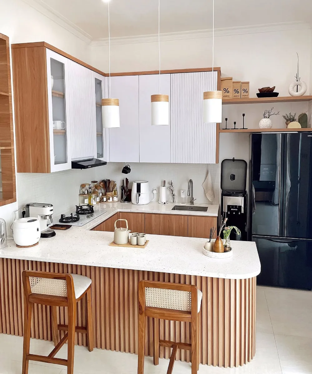Long narrow kitchen with light wood cabinets, open shelving, and a patterned runner