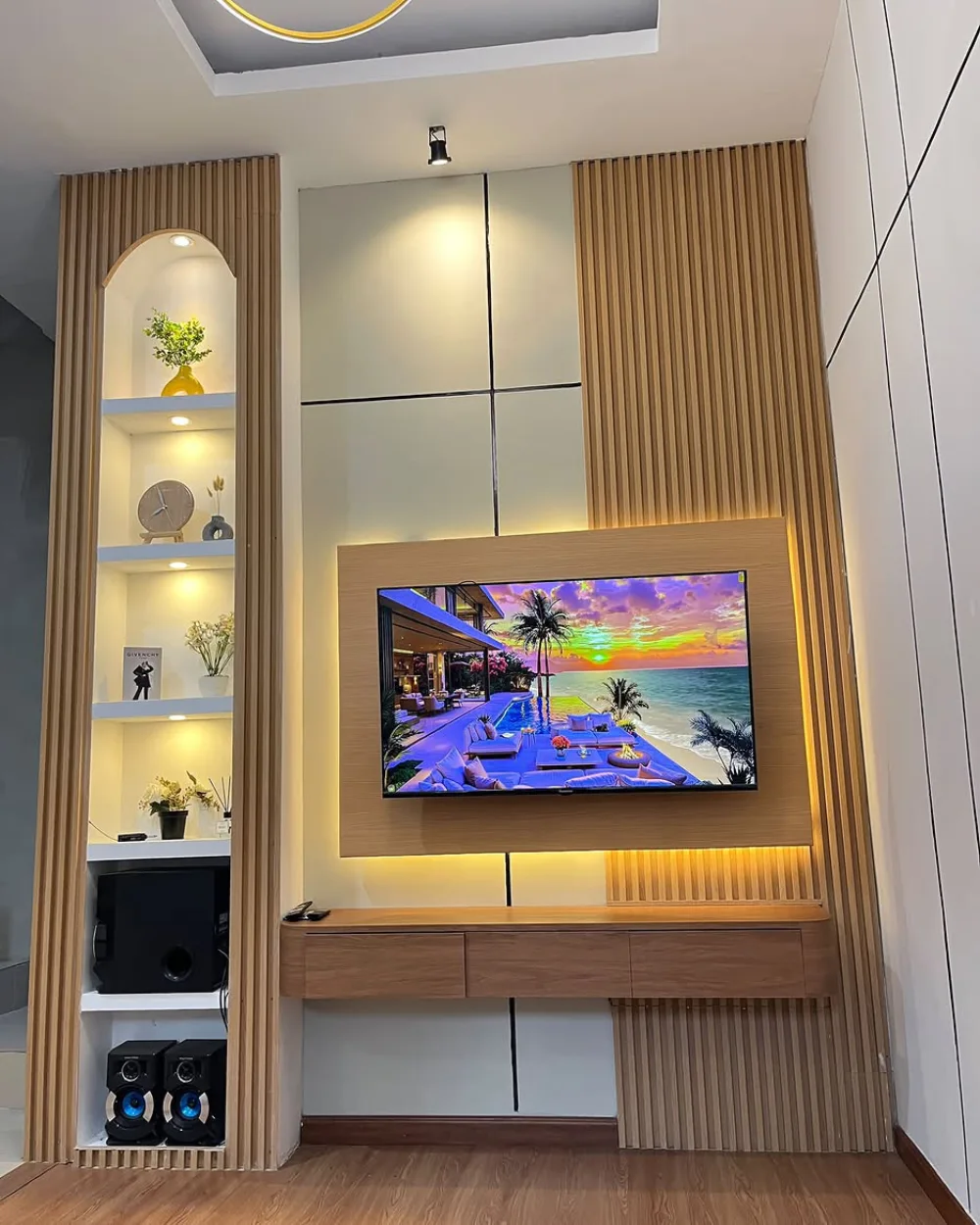 Modern living room TV wall with wood paneling and built-in shelves