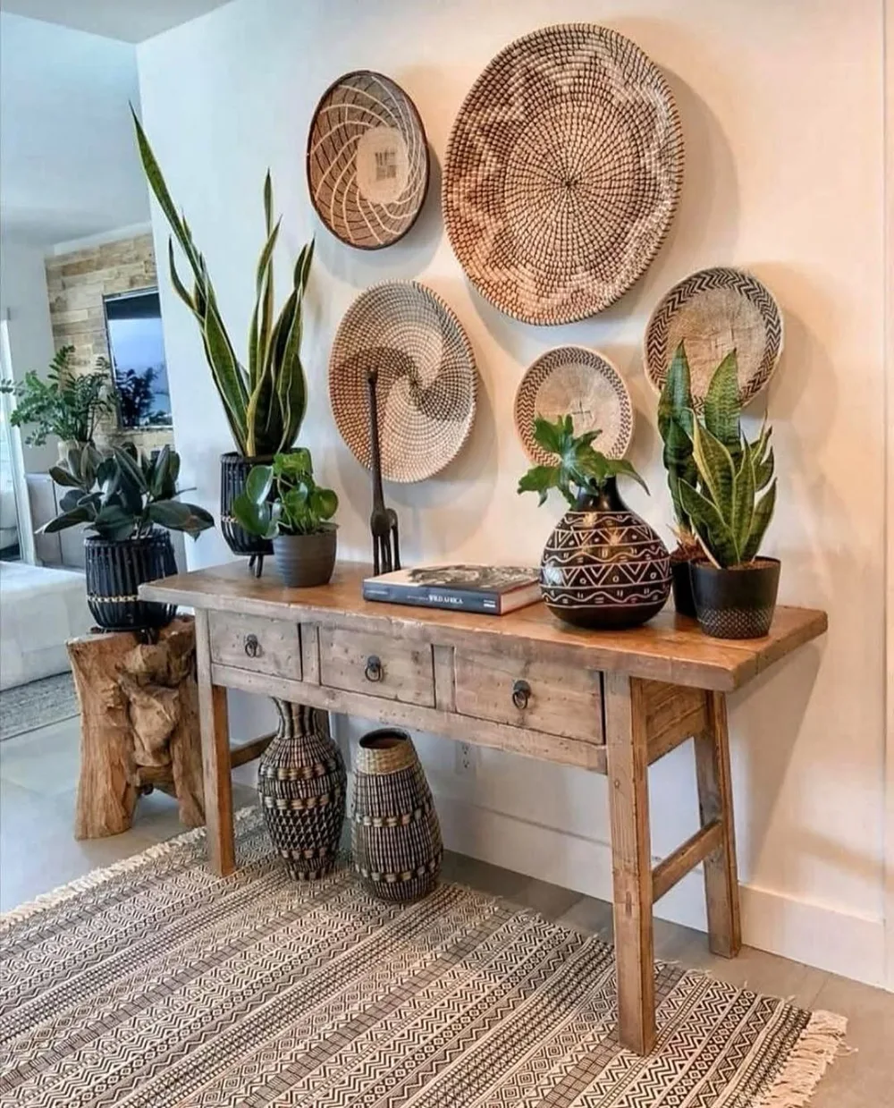 Living room wall decorated with woven baskets and natural textures