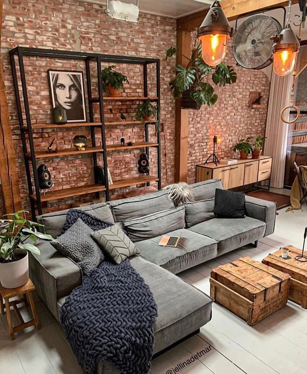 Industrial living room with exposed brick walls and open shelving