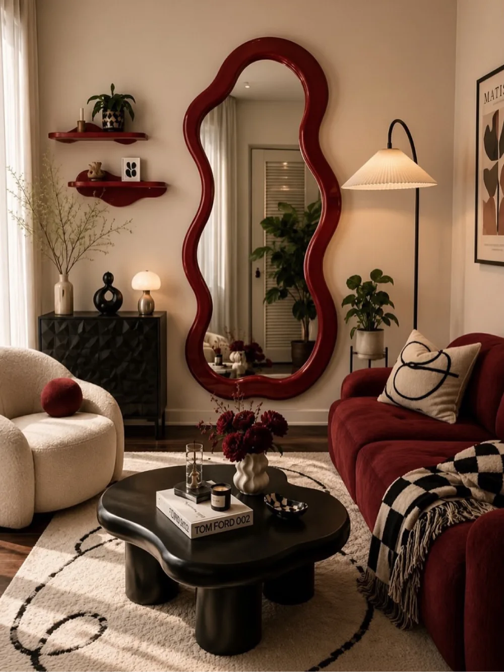 Living room with a large sculptural red-framed mirror