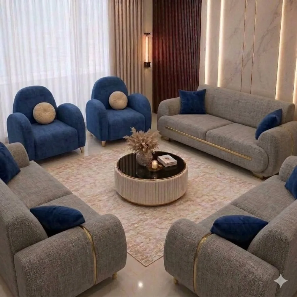 Gray sofa surrounded by navy blue accent chairs and pillows in an elegant living room