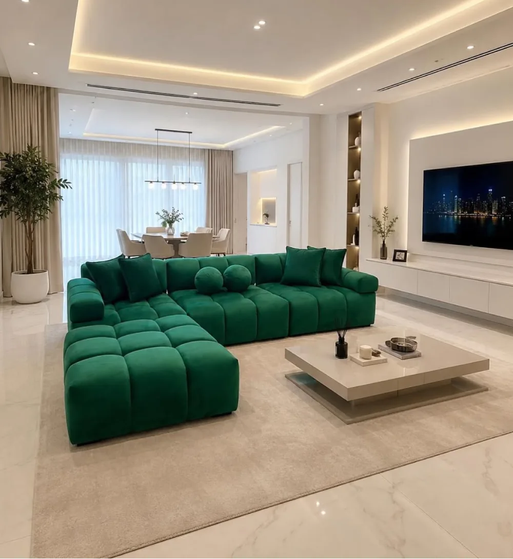 Deep emerald green sectional sofa in an elegant modern living room