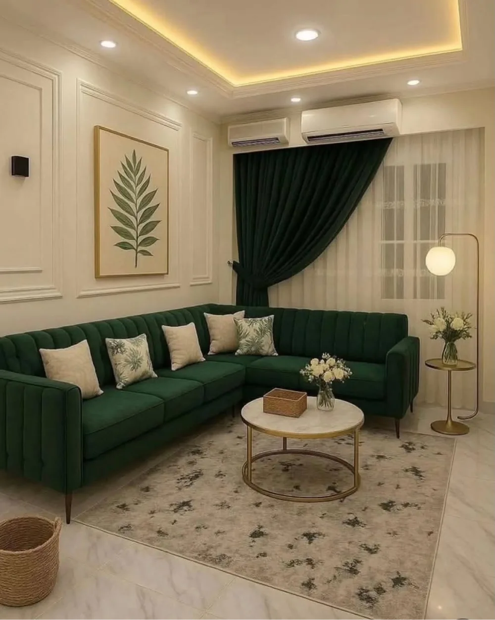 Dark green sectional sofa with cream pillows and a round coffee table