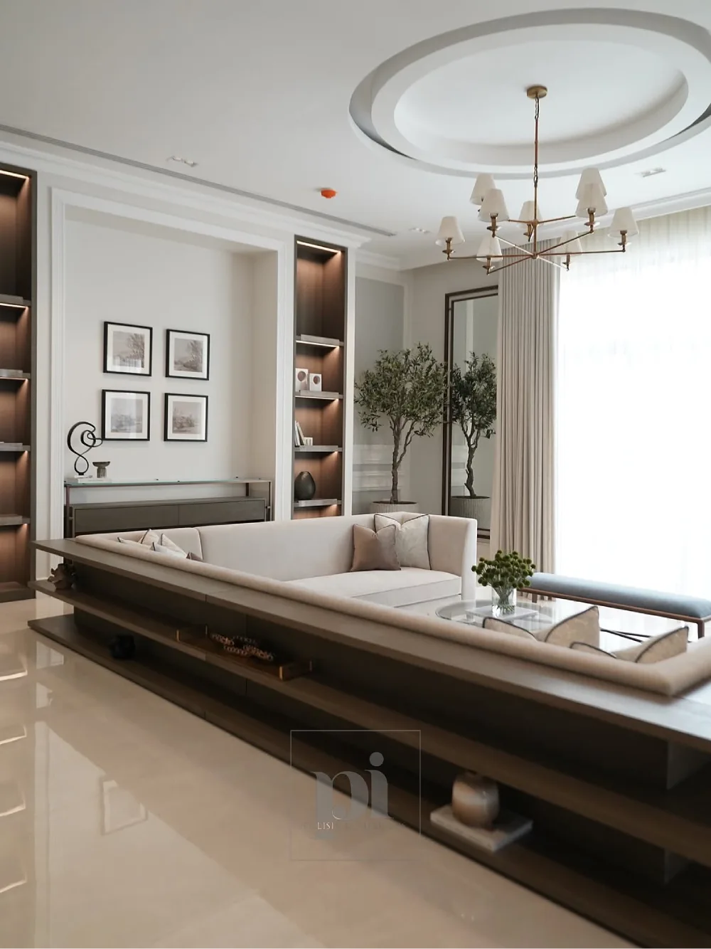 Elegant sunken living room with cream sectional seating and built-in lighting
