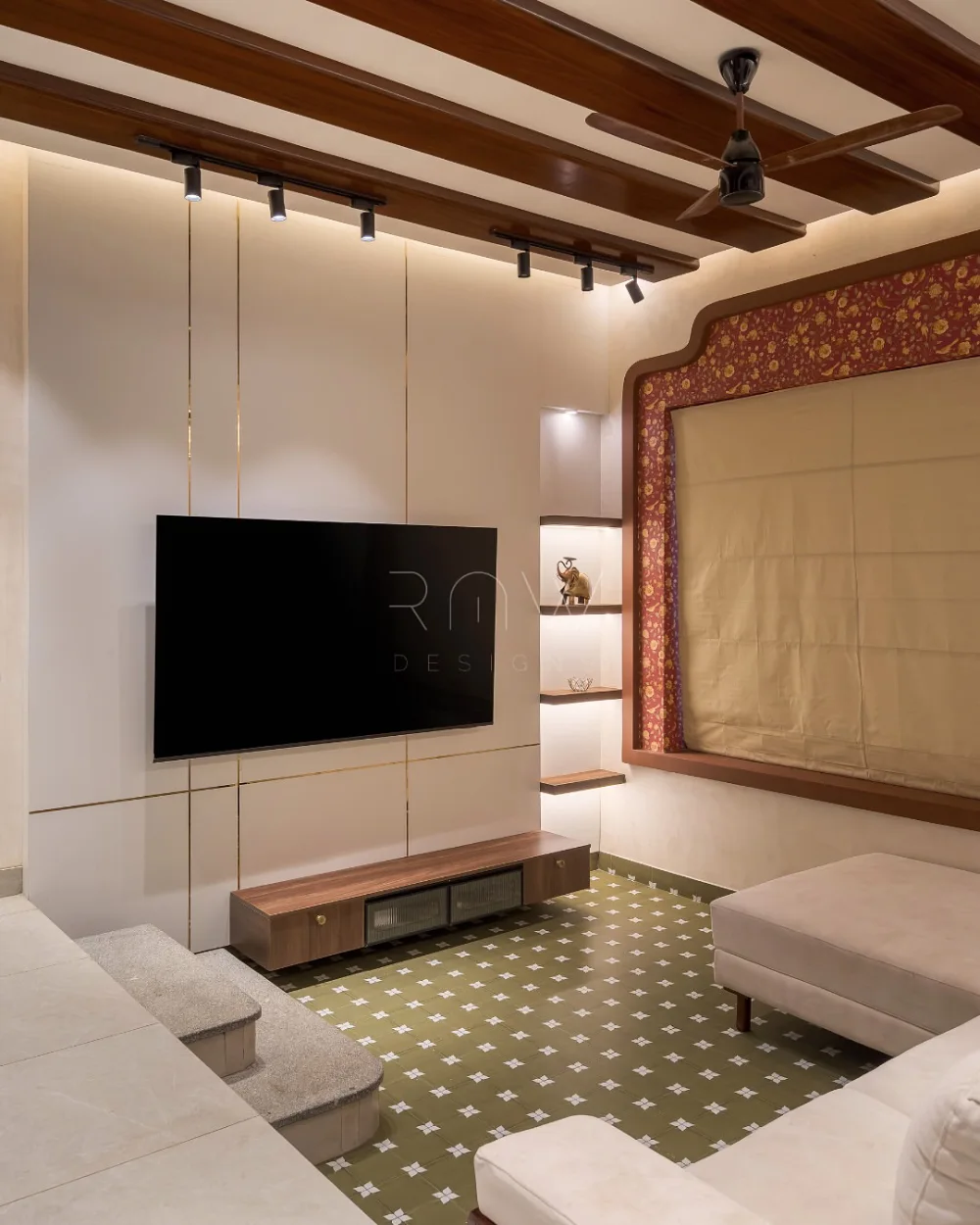 Elegant sunken living room with patterned rug and warm wood ceiling