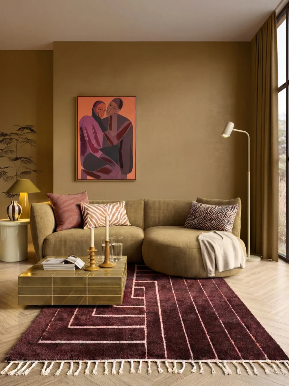 Rich earthy living room with brown sofa, burgundy geometric rug, warm artwork, and brass accents