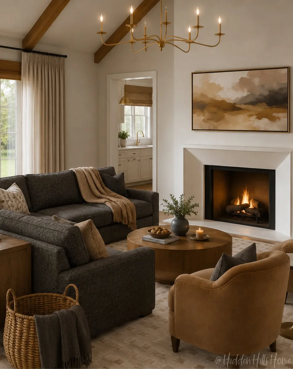 Dark gray sofas with warm wood accents and a brown leather chair around a fireplace