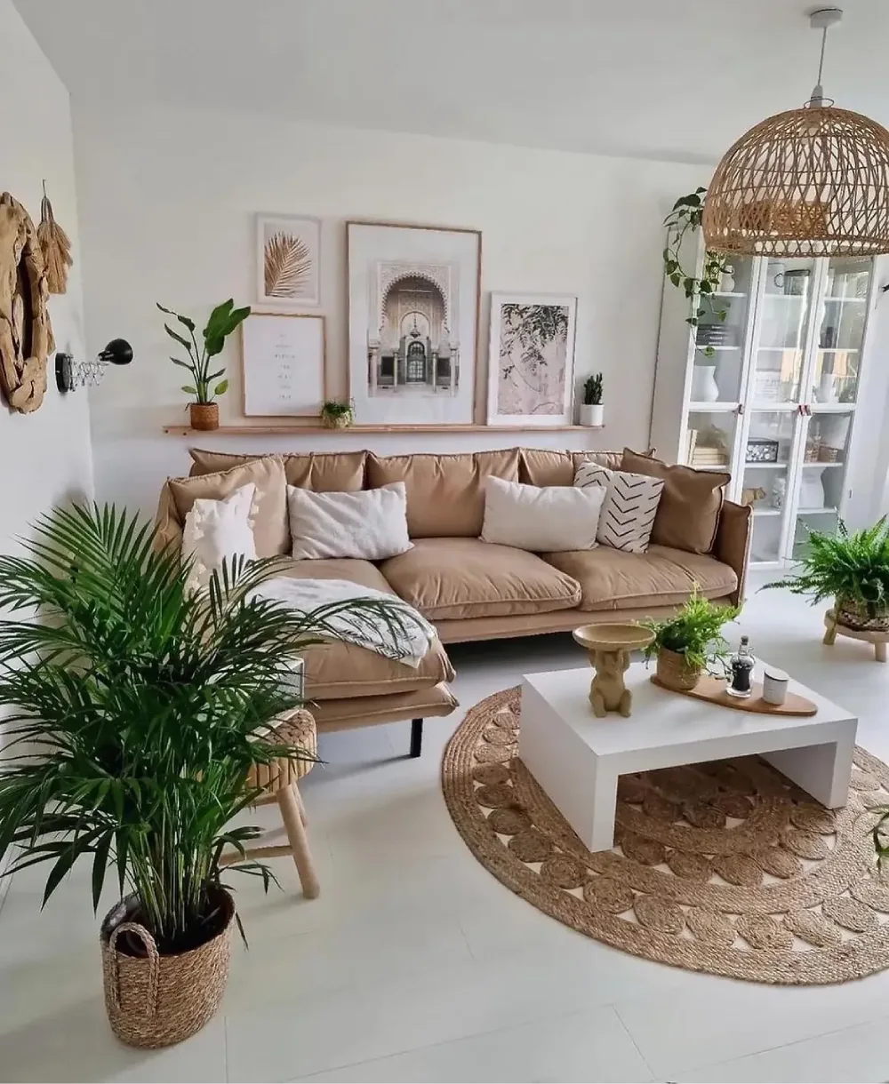 Neutral living room with beige sofa, woven rug, rattan pendant, and houseplants